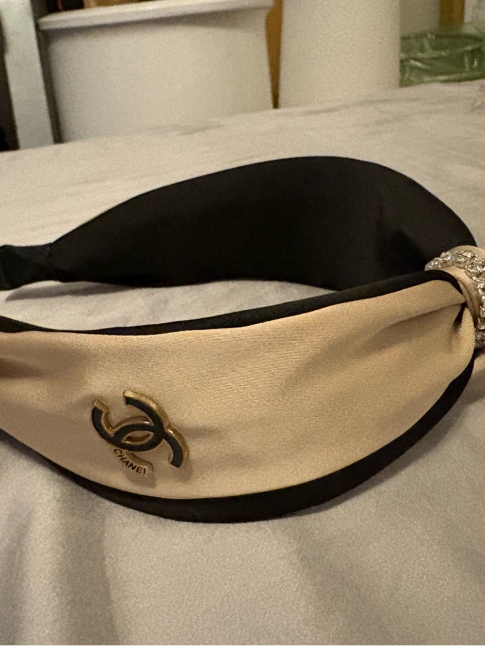 Charm Two-Tone Padded Satin Headband in Beige and Black with Gold Emblem